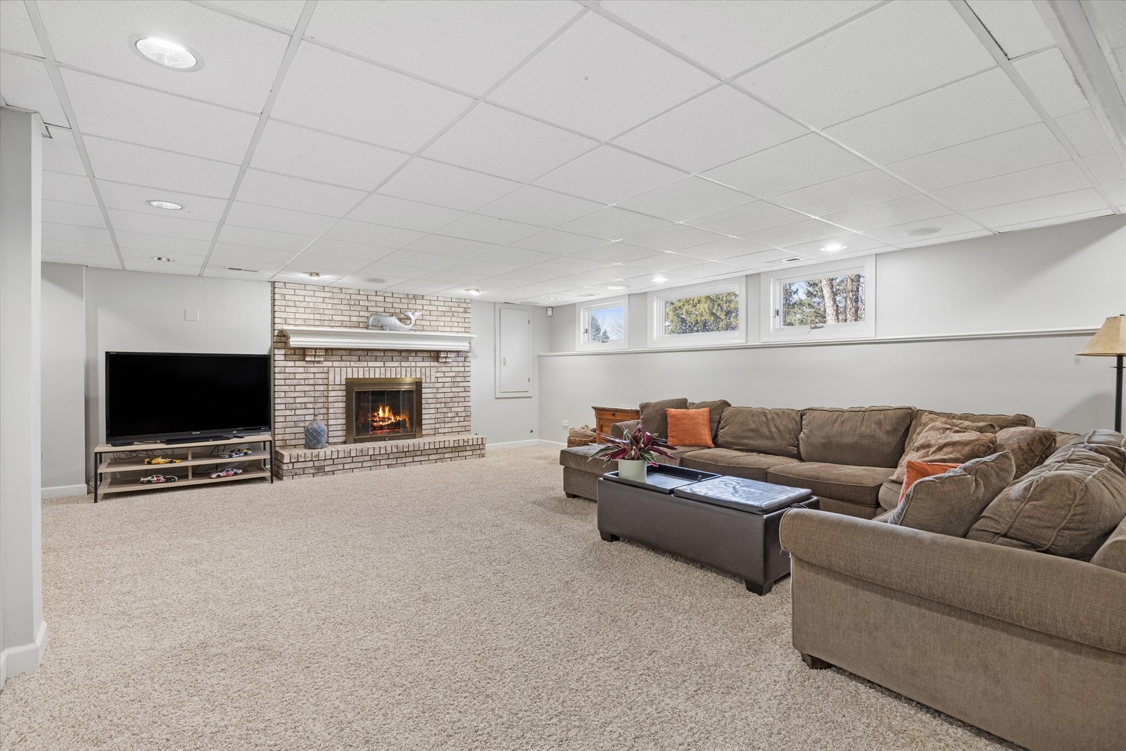 2711 Wendy Road Naperville, IL 60565 - Photo 32 of 49 a living room with furniture and a flat screen tv