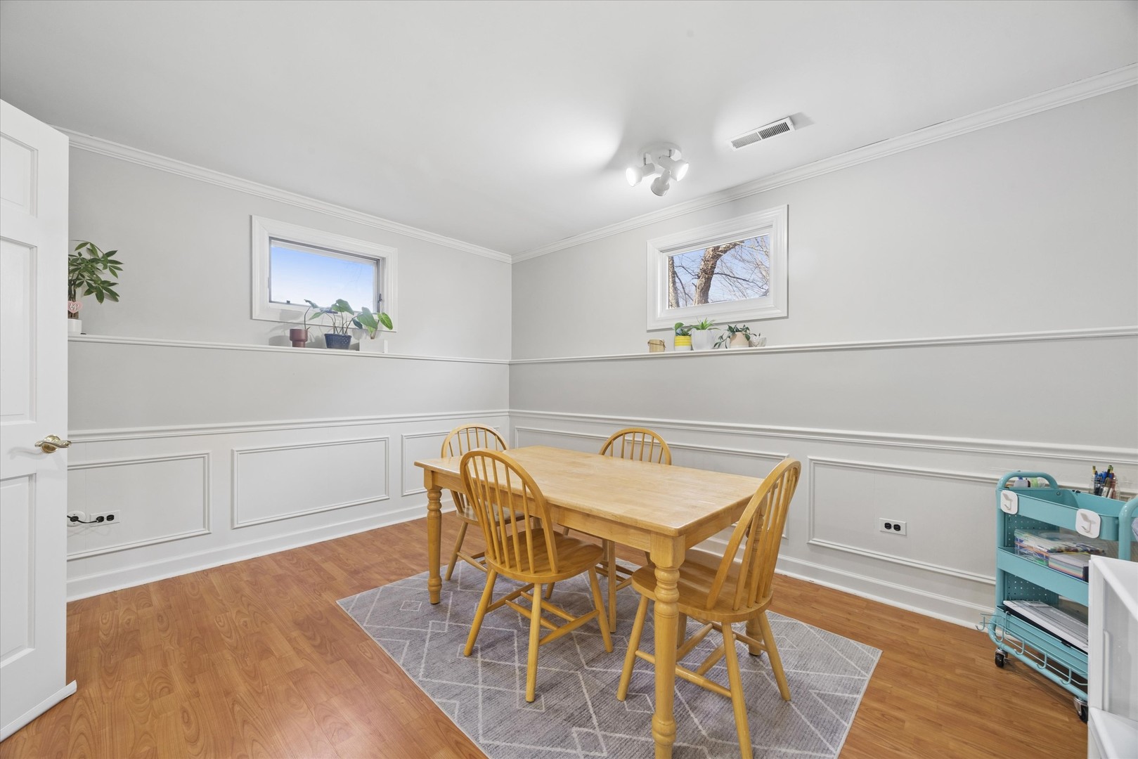 2711 Wendy Road Naperville, IL 60565 - Photo 35 of 49 a view of a dining room with furniture and wooden floor