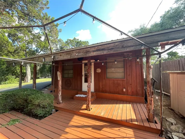 a view of house with backyard and porch