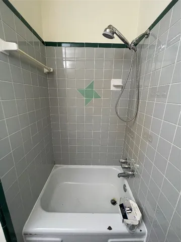 a bathroom with a bath tub