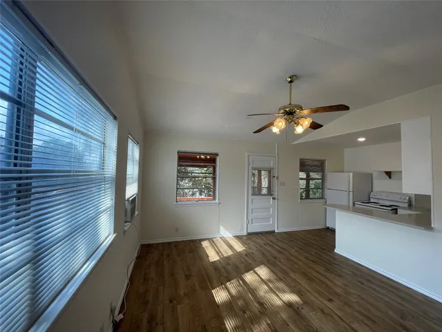 a view of a kitchen and wooden floor