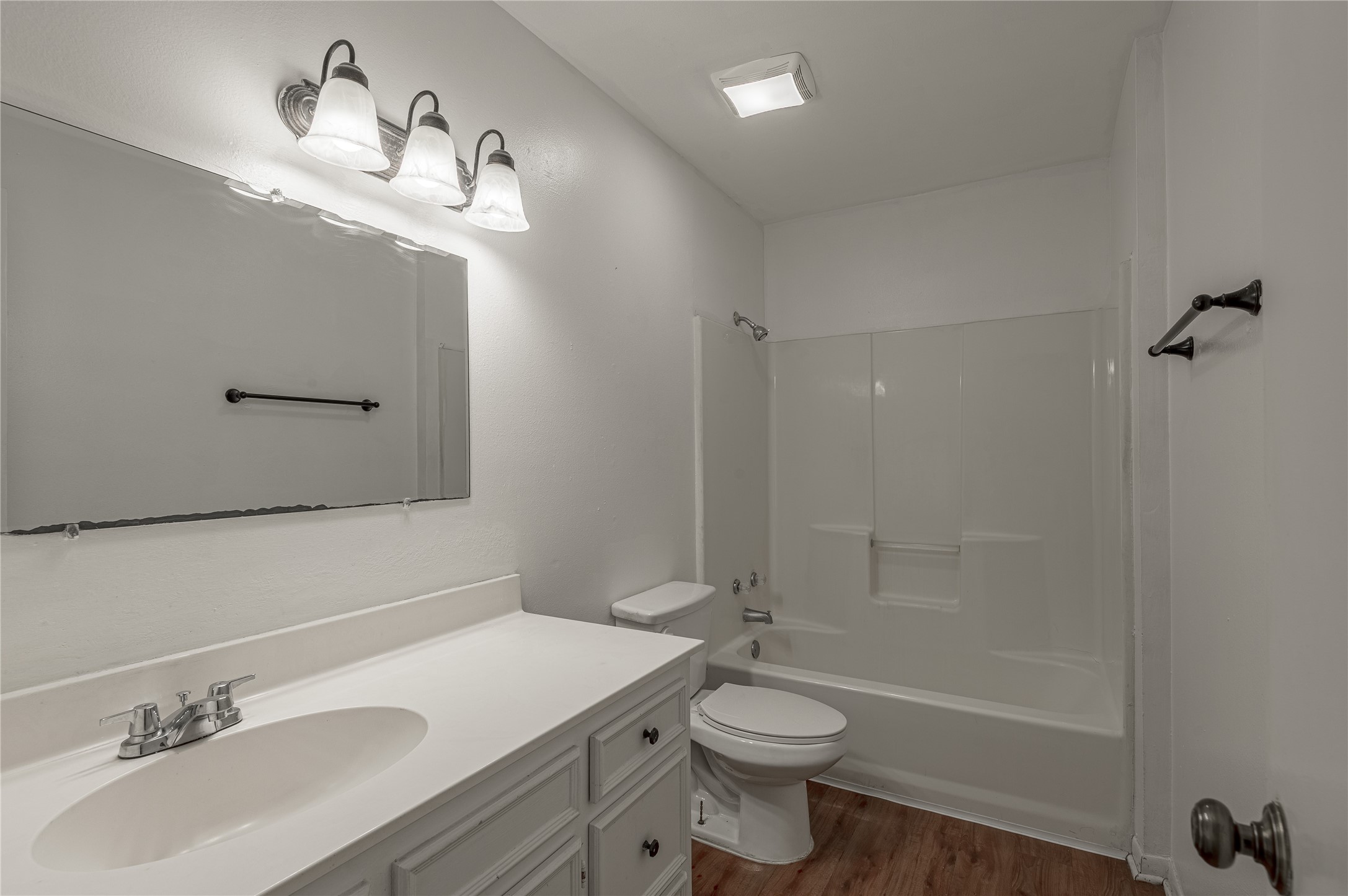 600 Palm Street, Unit 12 Huntsville, TX 77340 - Photo 15 of 23 a bathroom with a sink a toilet and shower