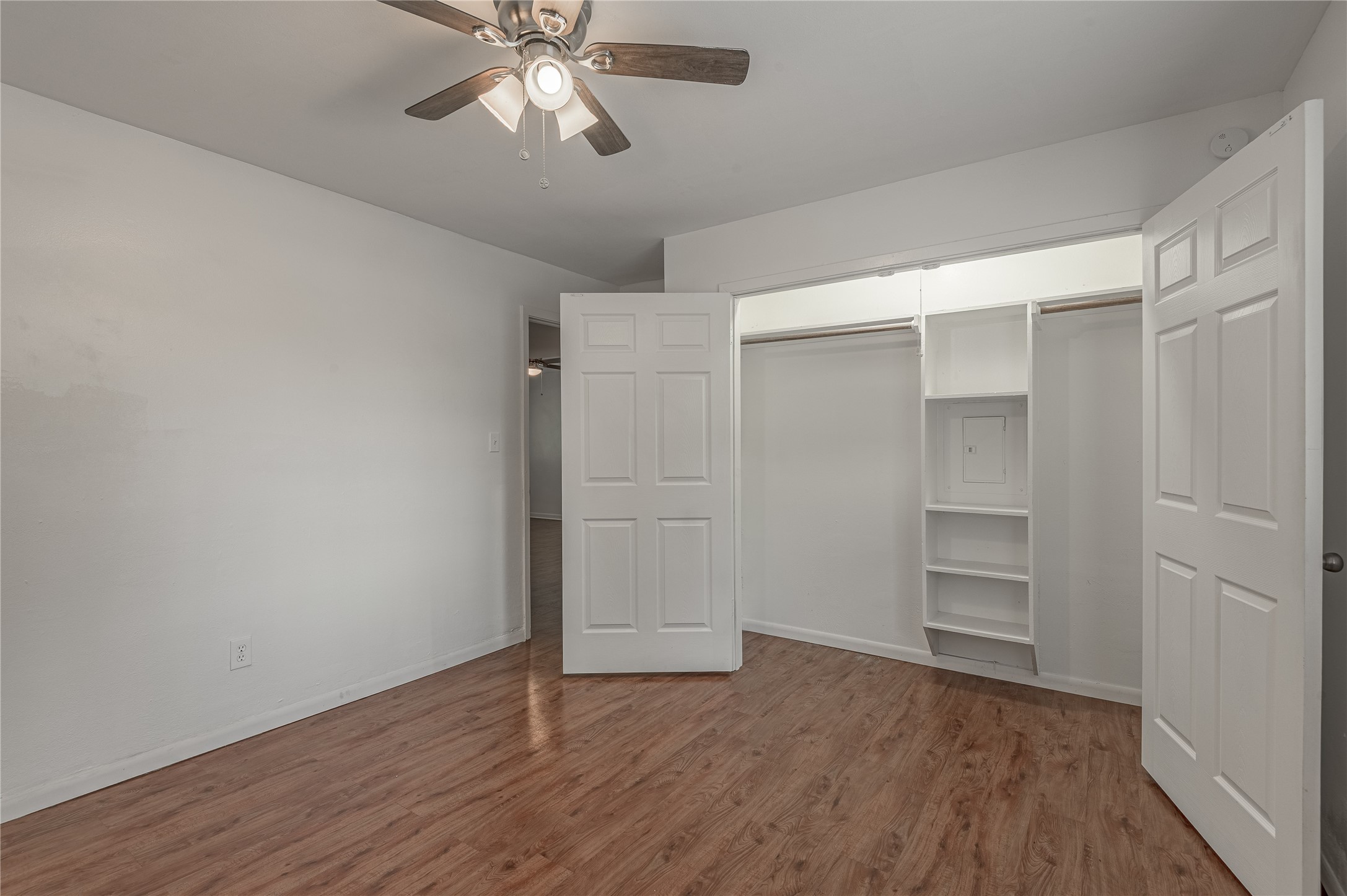 600 Palm Street, Unit 12 Huntsville, TX 77340 - Photo 18 of 23 a view of an empty room with wooden floor