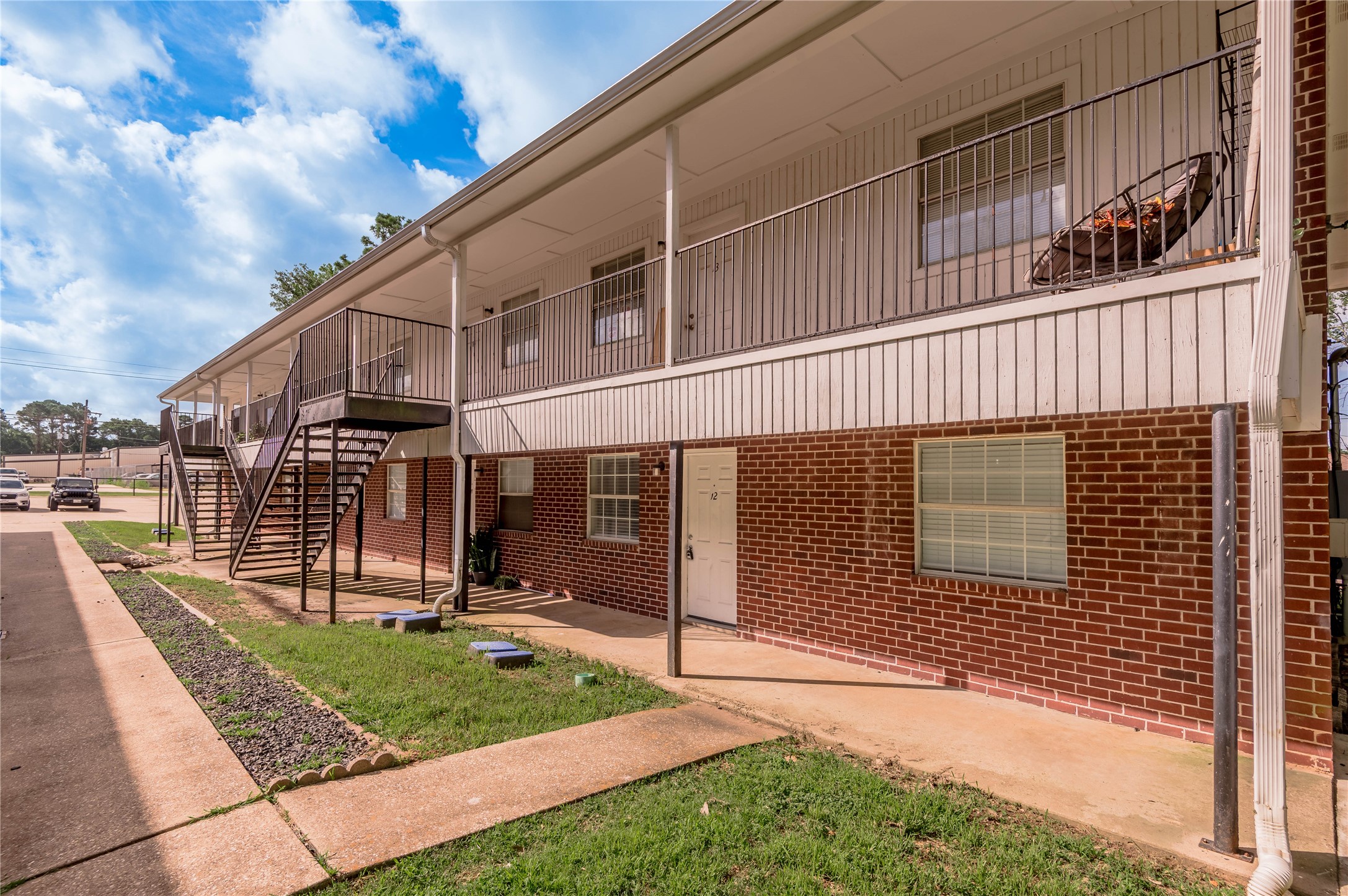 600 Palm Street, Unit 12 Huntsville, TX 77340 - Photo 2 of 23 a view of a house with a yard