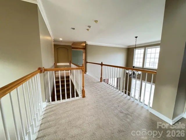 a view of staircase with rug floor