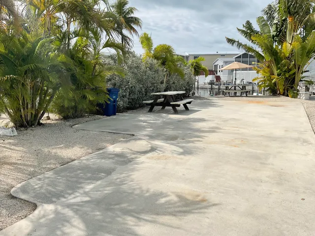 a view of backyard with a table and chairs