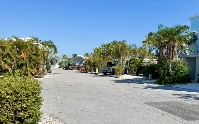 a view of a street with a building in the background