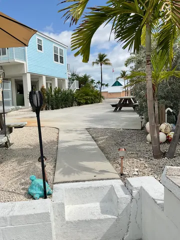 a view of a backyard with a fountain