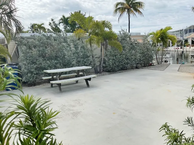 a view of a backyard with a sitting area