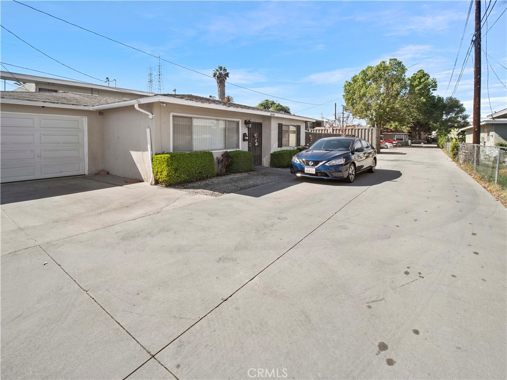 16840 Passage Paramount Ca Paramount, CA 90723 - Photo 12 of 16 a car parked in front of a white house