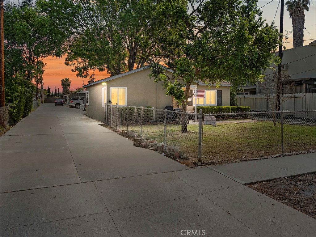 16840 Passage Paramount Ca Paramount, CA 90723 - Photo 3 of 16 a view of a house with a tree in the background