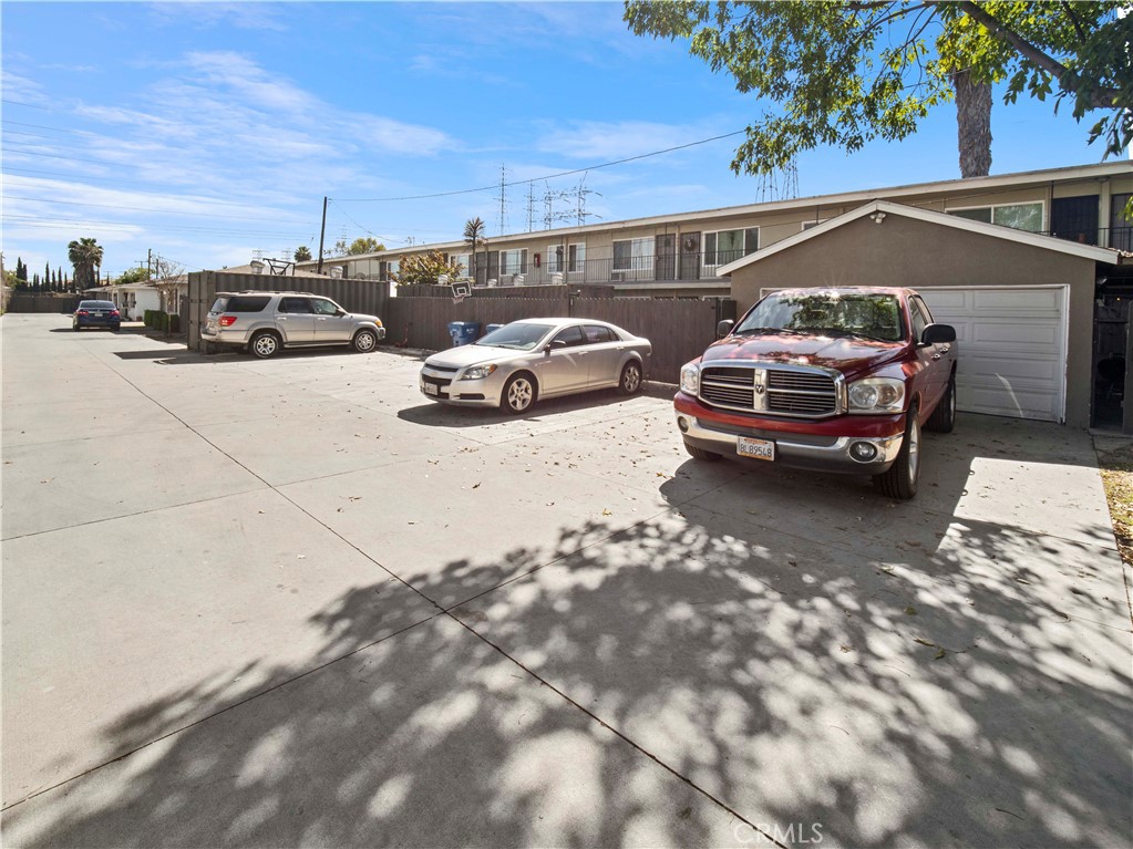 16840 Passage Paramount Ca Paramount, CA 90723 - Photo 7 of 16 a view of parking with cars parked