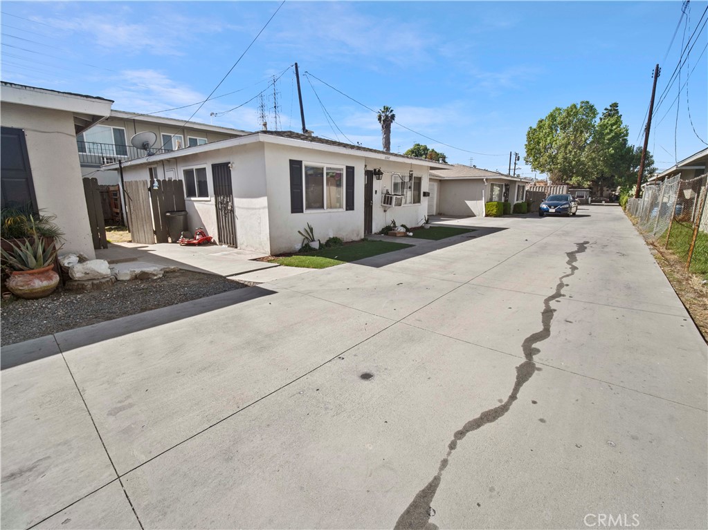 16840 Passage Paramount Ca Paramount, CA 90723 - Photo 8 of 16 a front view of a house with a yard