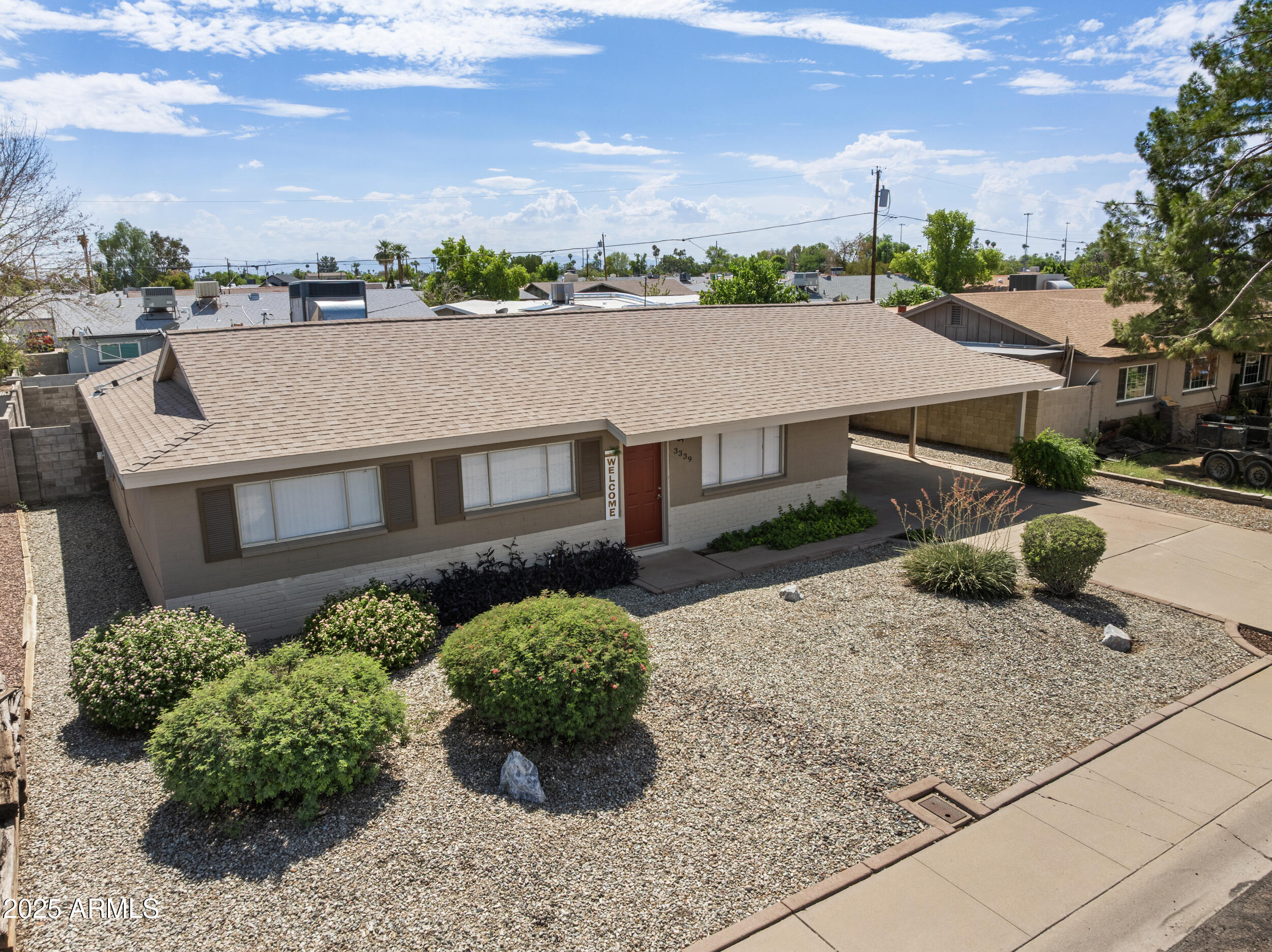 3339 West Shaw Butte Drive Phoenix, AZ 85029 - Photo 2 of 16 an aerial view of a house with a yard and potted plants
