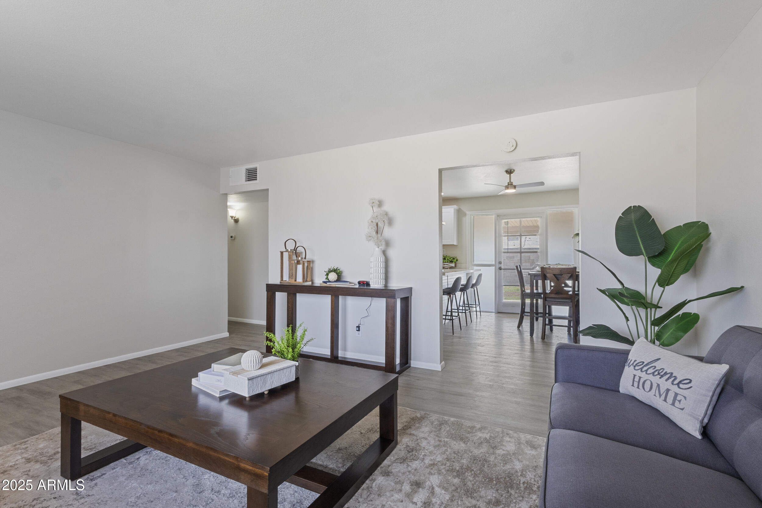 3339 West Shaw Butte Drive Phoenix, AZ 85029 - Photo 4 of 16 a living room with furniture and wooden floor