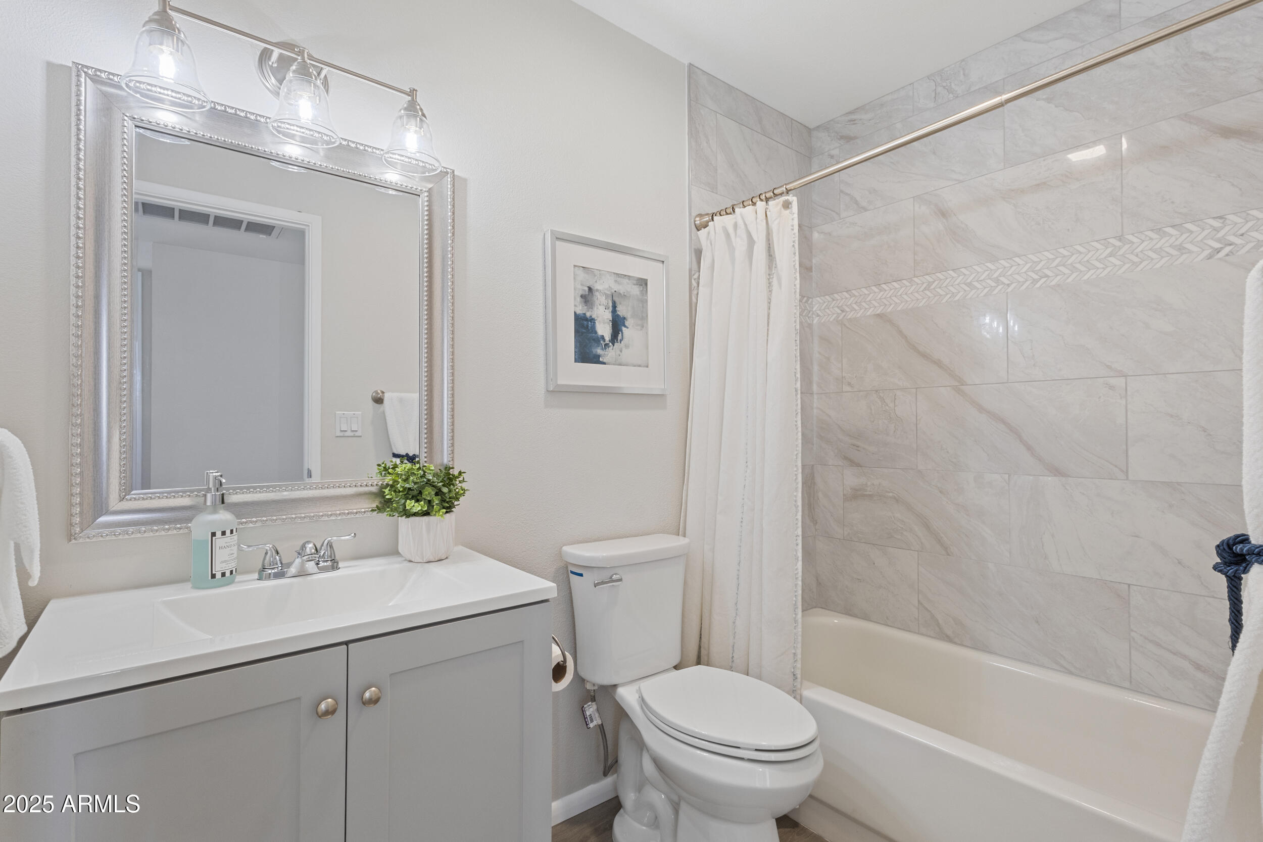 3339 West Shaw Butte Drive Phoenix, AZ 85029 - Photo 7 of 16 a bathroom with a sink toilet and shower