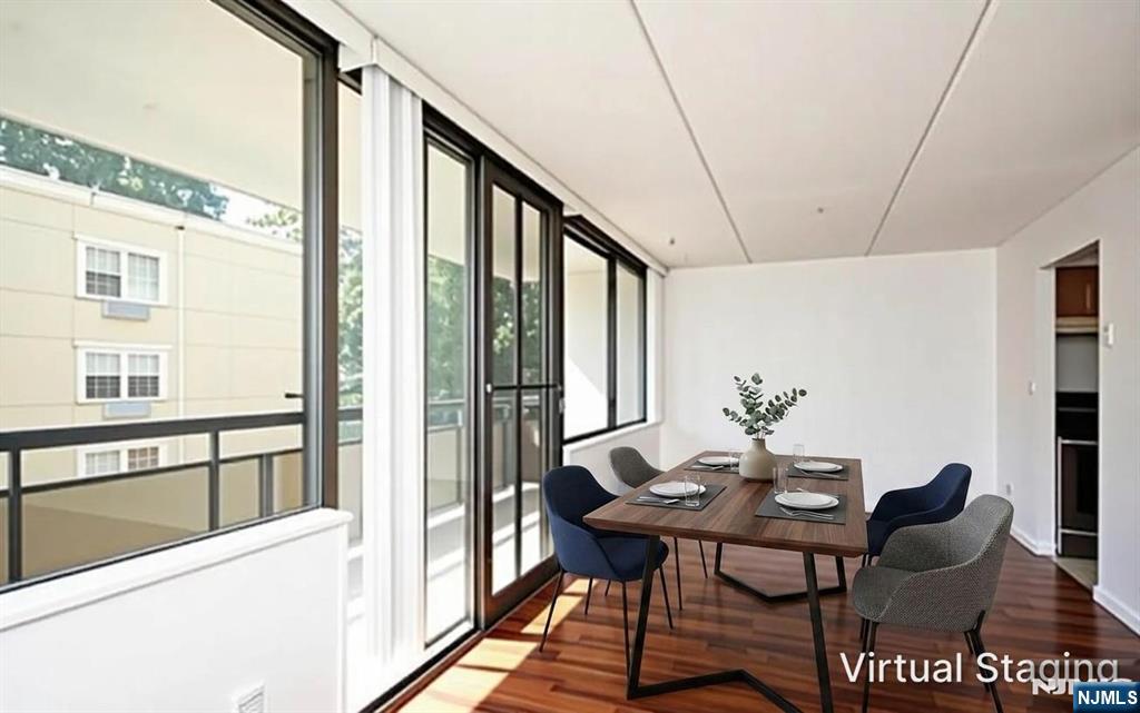 555 Gorge Road, Unit 3B Cliffside Park, NJ 07010 - Photo 3 of 14 a view of a dining room with furniture window and wooden floor