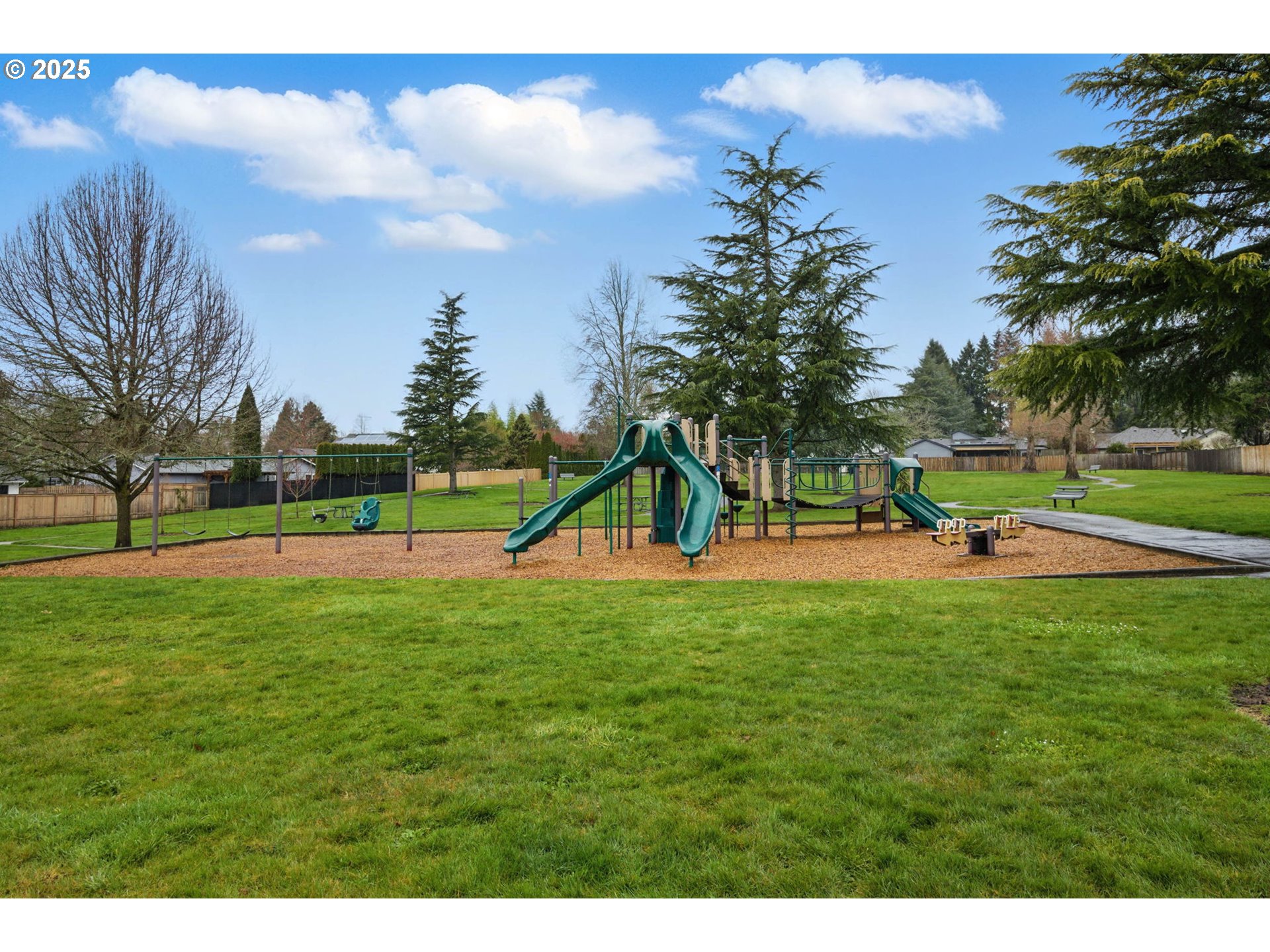 29460 Southwest Volley Street, Unit 67 Wilsonville, OR 97070 - Photo 19 of 24 a view of a park with swings and slides