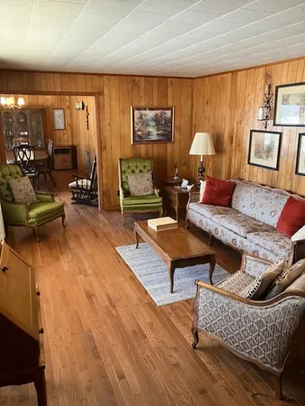 a living room with furniture and a table