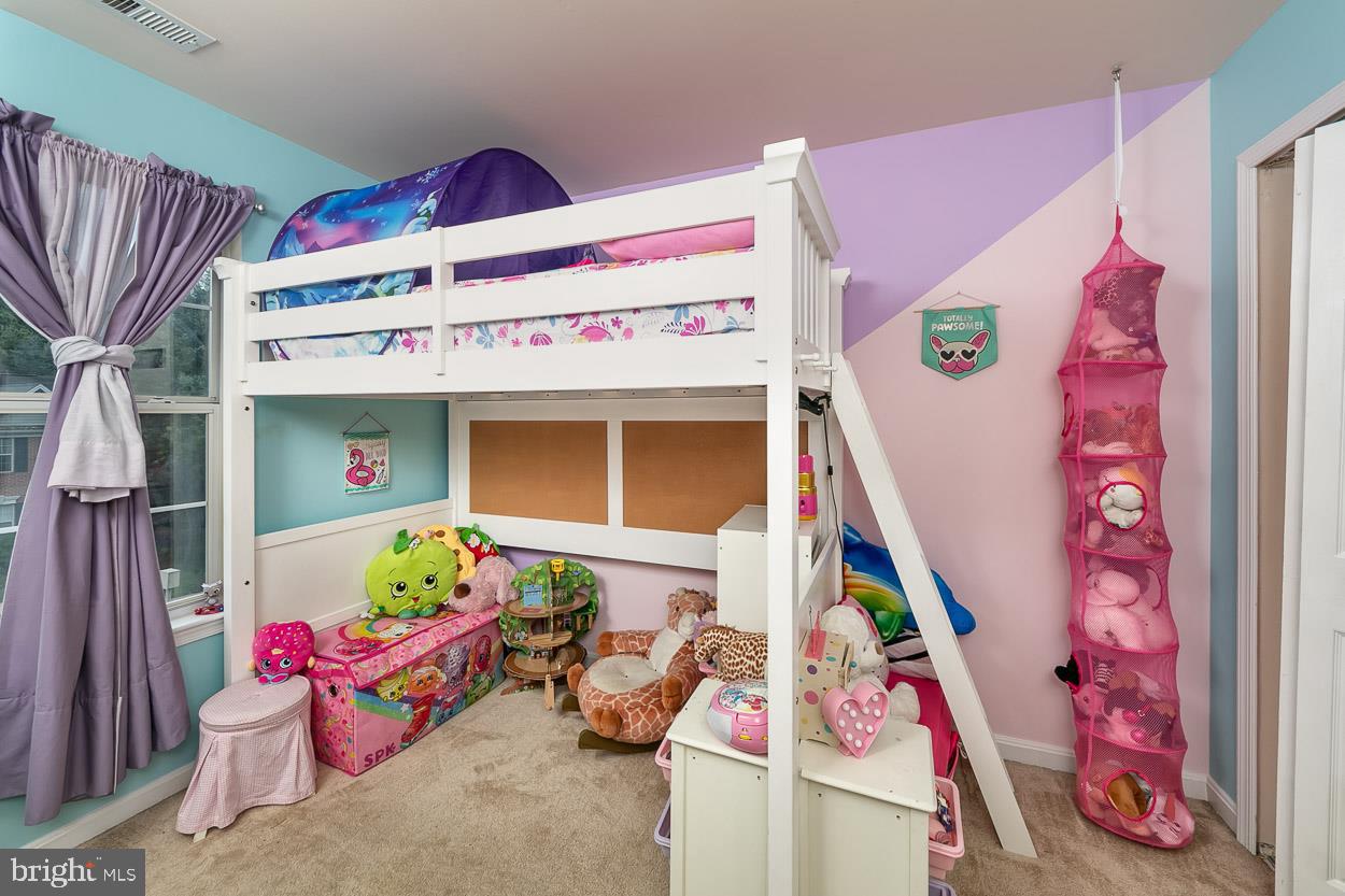 3504 Corn Stream Road Randallstown, MD 21133 - Photo 21 of 34 a utility room with toys and wooden floor