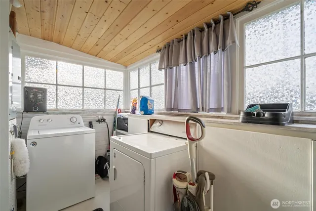 a kitchen with stainless steel appliances a refrigerator and a stove top oven