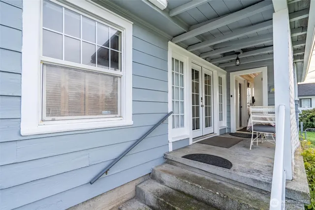 a view of a house with pool and sitting area