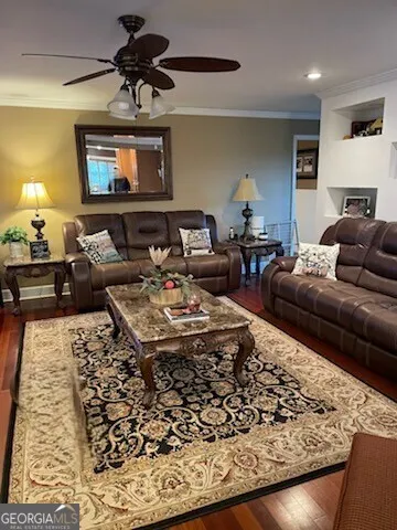 a living room with furniture and a rug