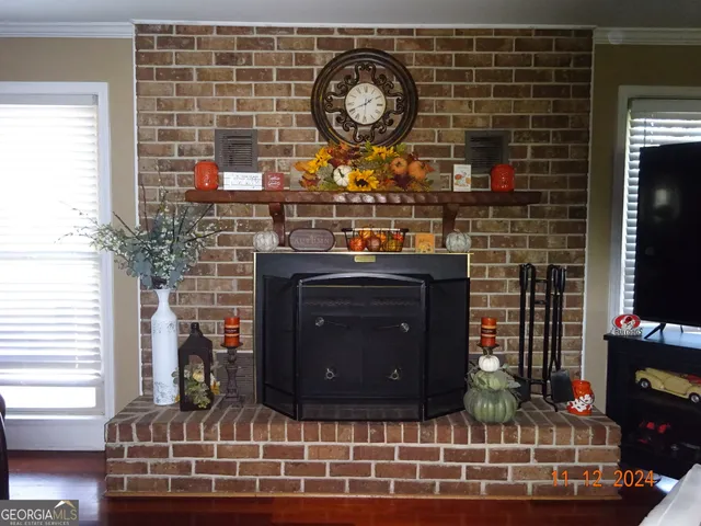 a table with a fireplace and a wine table in it