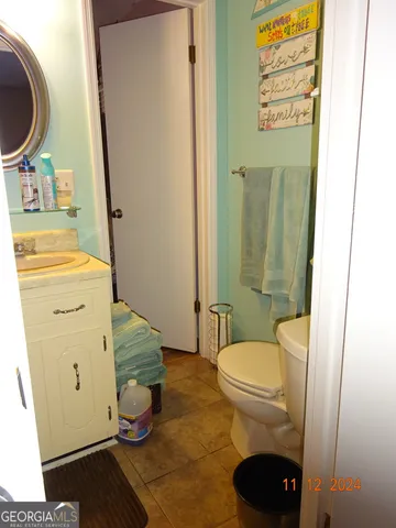 a bathroom with a toilet and a sink