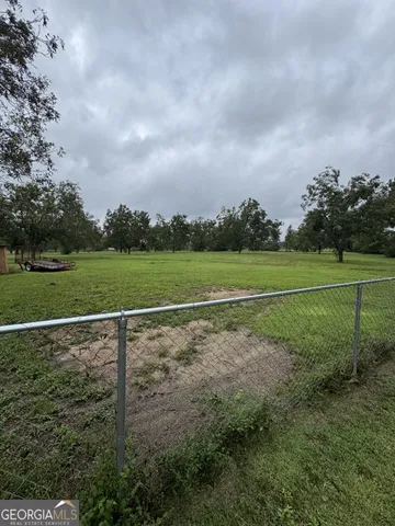 a view of a field with a big yard