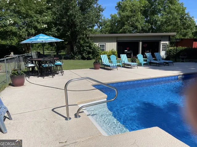 a view of a patio with furniture and a table