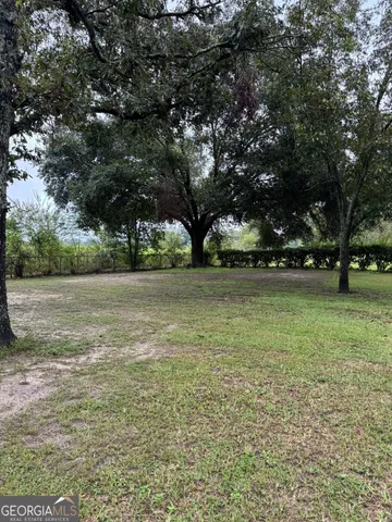 a view of outdoor space with deck and yard