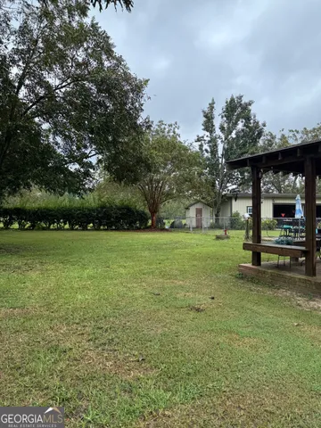 a view of a tree in front of a house