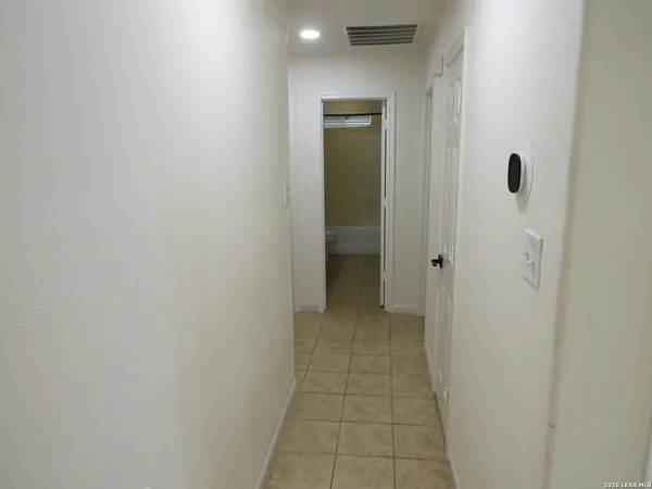 a view of a bathroom from a hallway