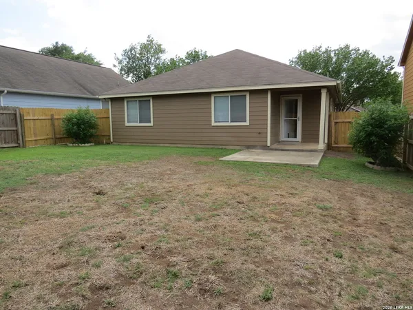 a view of a house with yard and a garden