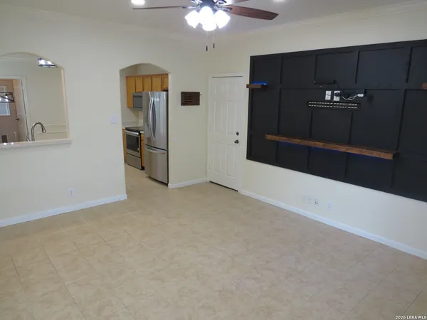 a view of an empty room with a bathroom