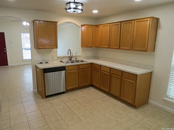 a kitchen with a sink and cabinets