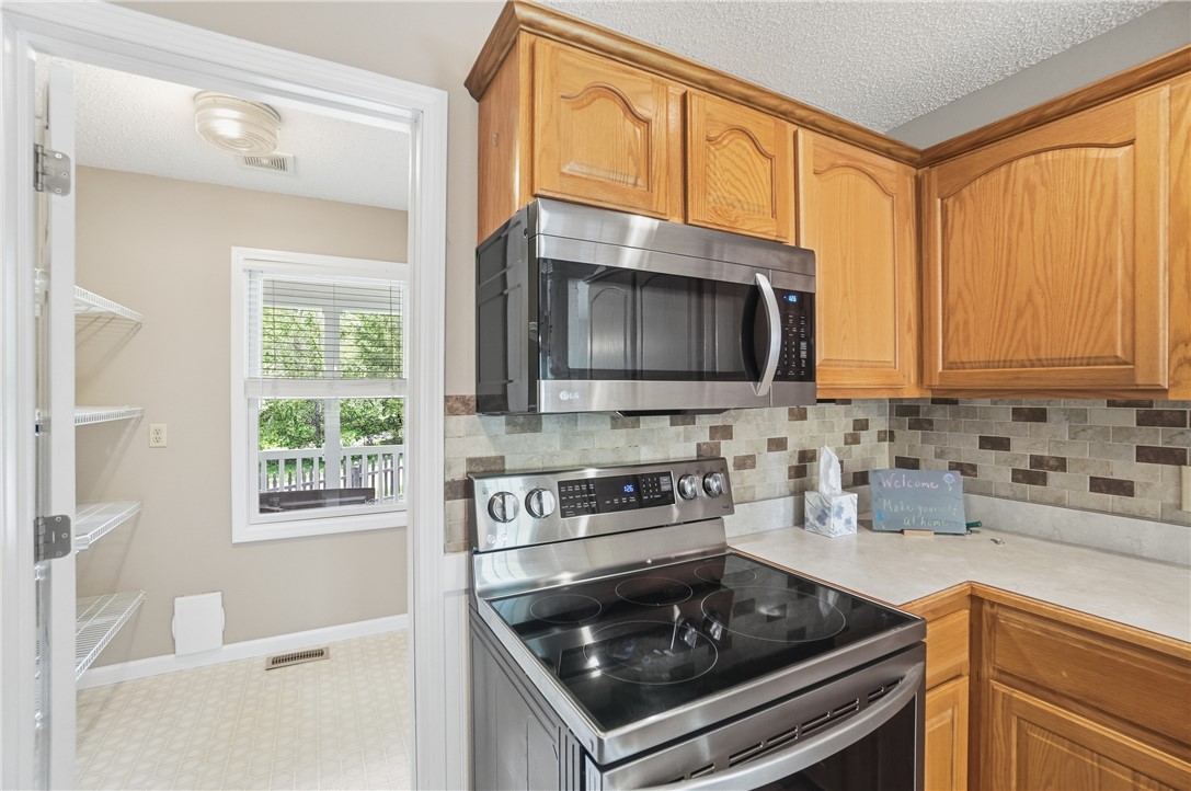 1208 Jarva Lane Springboro, OH 45066 - Photo 28 of 75 This bright kitchen features modern appliances and convenient pantry access for effortless meal preparation.