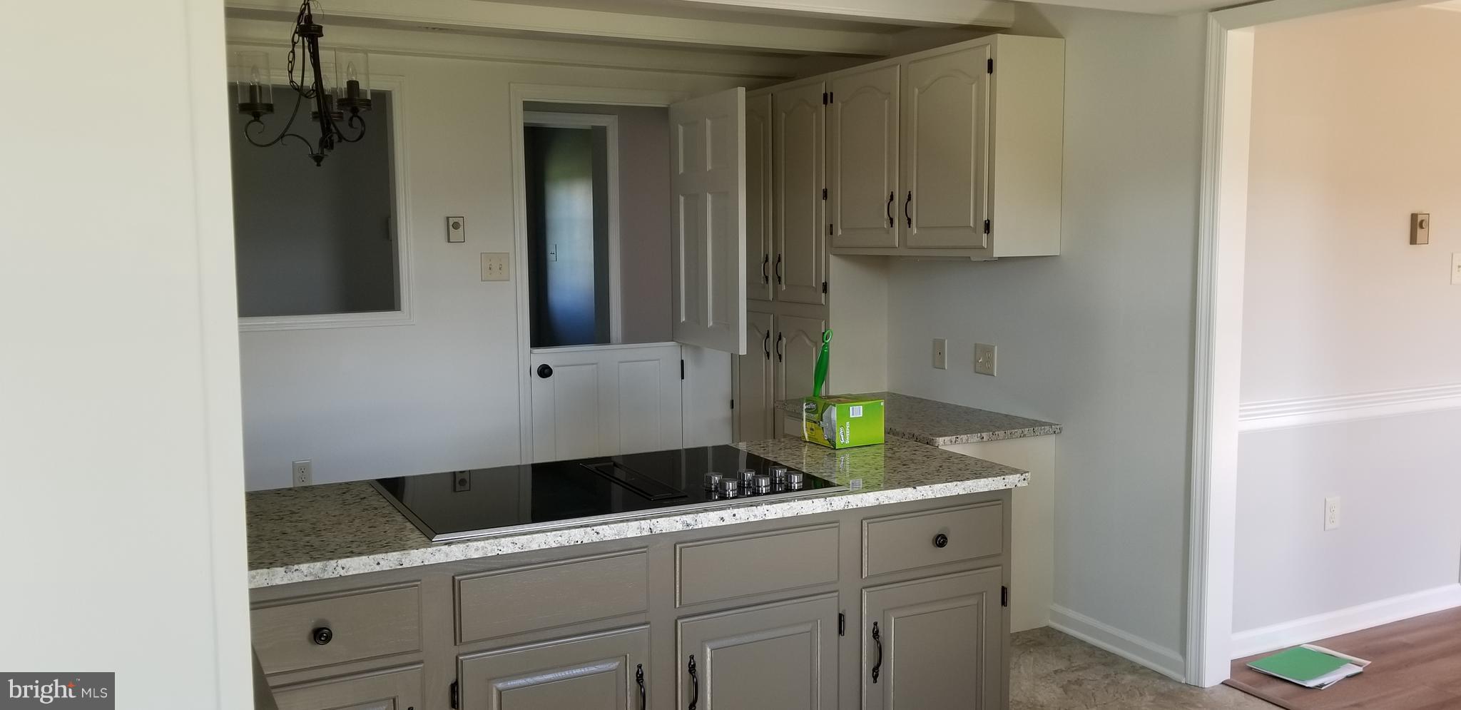 15515 Broadfording Road Clear Spring, MD 21722 - Photo 2 of 19 a bathroom with a granite countertop sink and a mirror