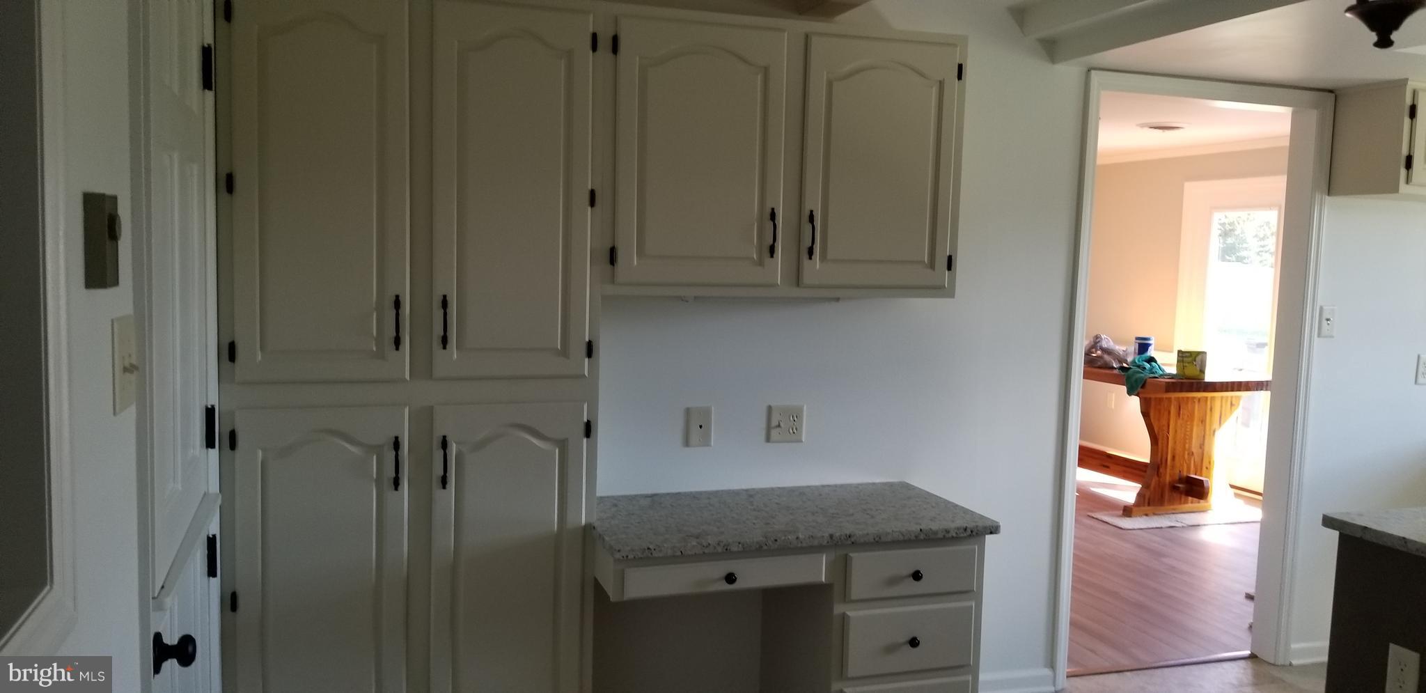 15515 Broadfording Road Clear Spring, MD 21722 - Photo 4 of 19 a room with cabinets and a wooden door
