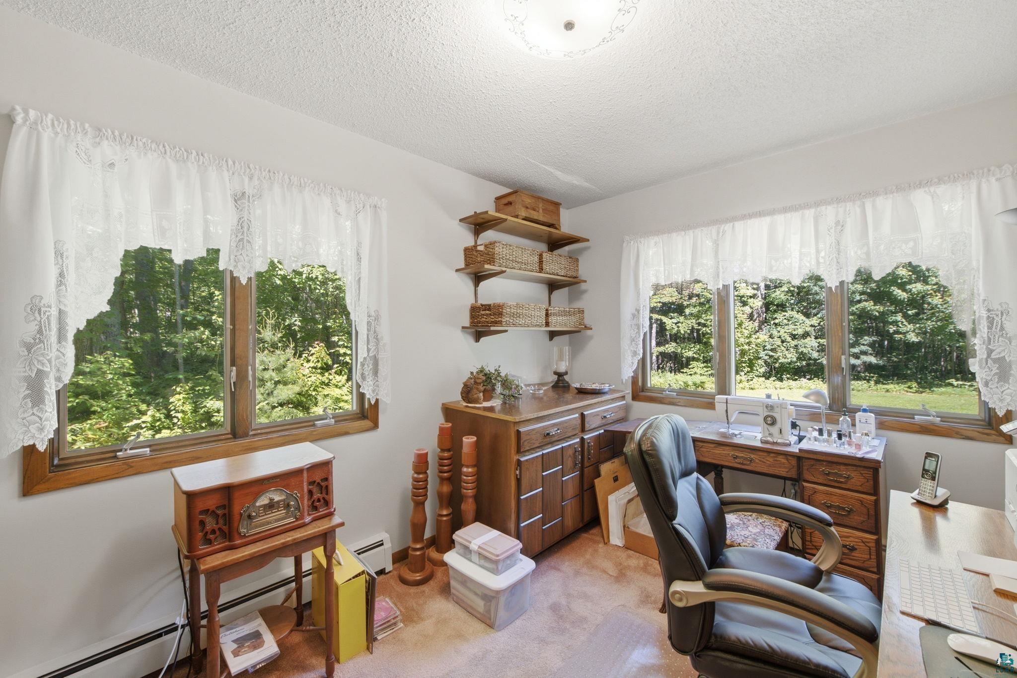 27485 South Kane Road Ashland, WI 54806 - Photo 6 of 35 Bright room with multiple windows overlooking natural greenery