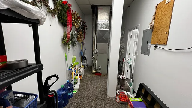 a lobby with furniture and a mirror