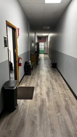 a white toilet sitting next to a bathroom sink