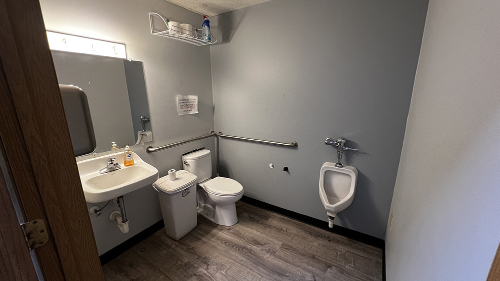 222 West Main Street Morrison, IL 61270 - Photo 15 of 21 a bathroom with a toilet sink and mirror