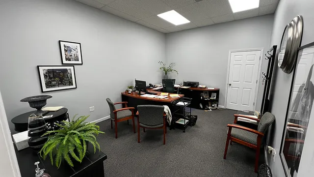 a room with furniture a air conditioner and a window