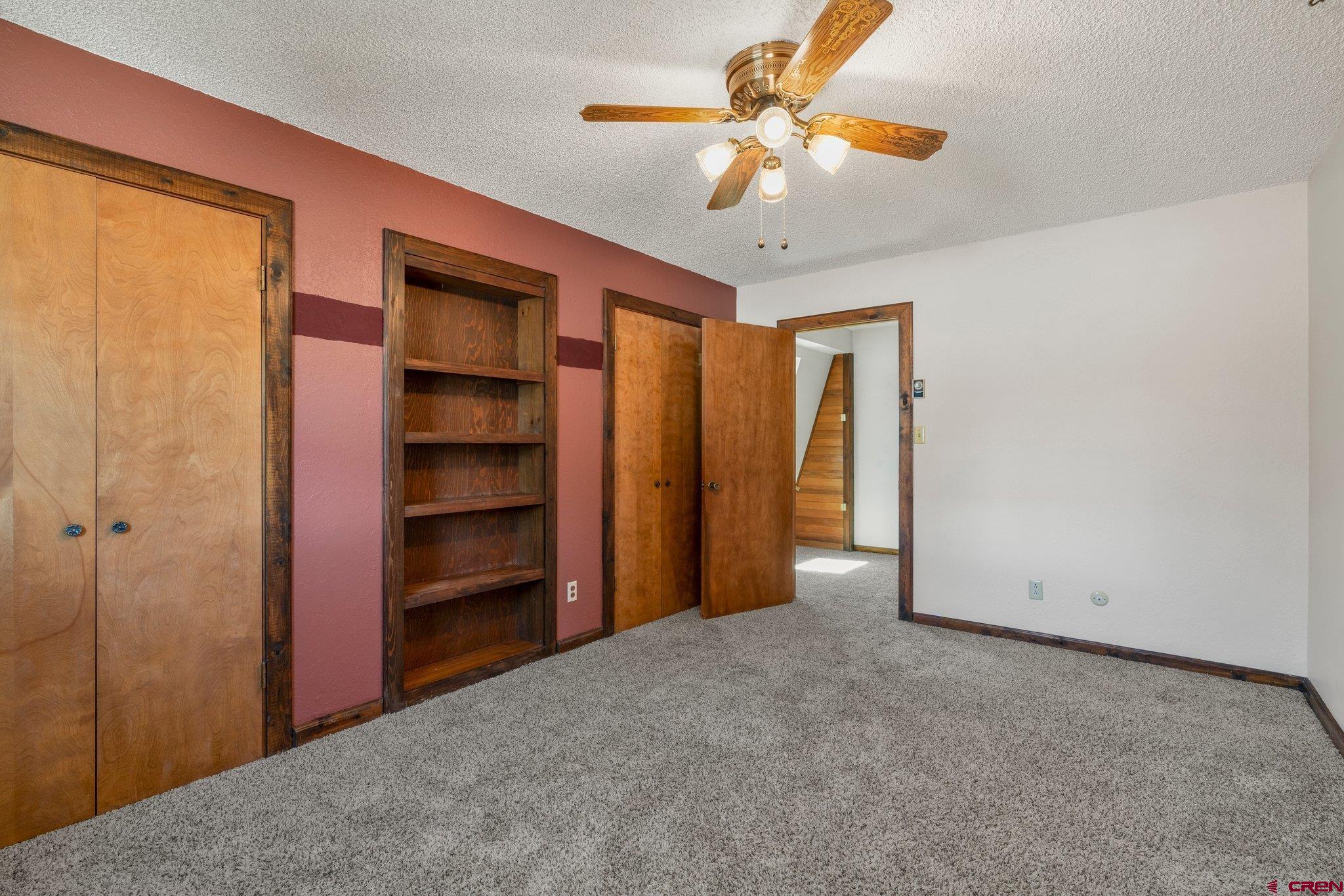 340 Ridge Road Durango, CO 81303 - Photo 14 of 35 a view of an empty room with a chandelier fan