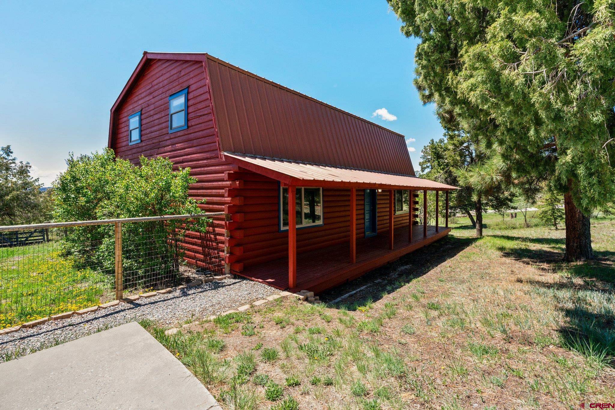 340 Ridge Road Durango, CO 81303 - Photo 20 of 35 a front view of a house with a yard