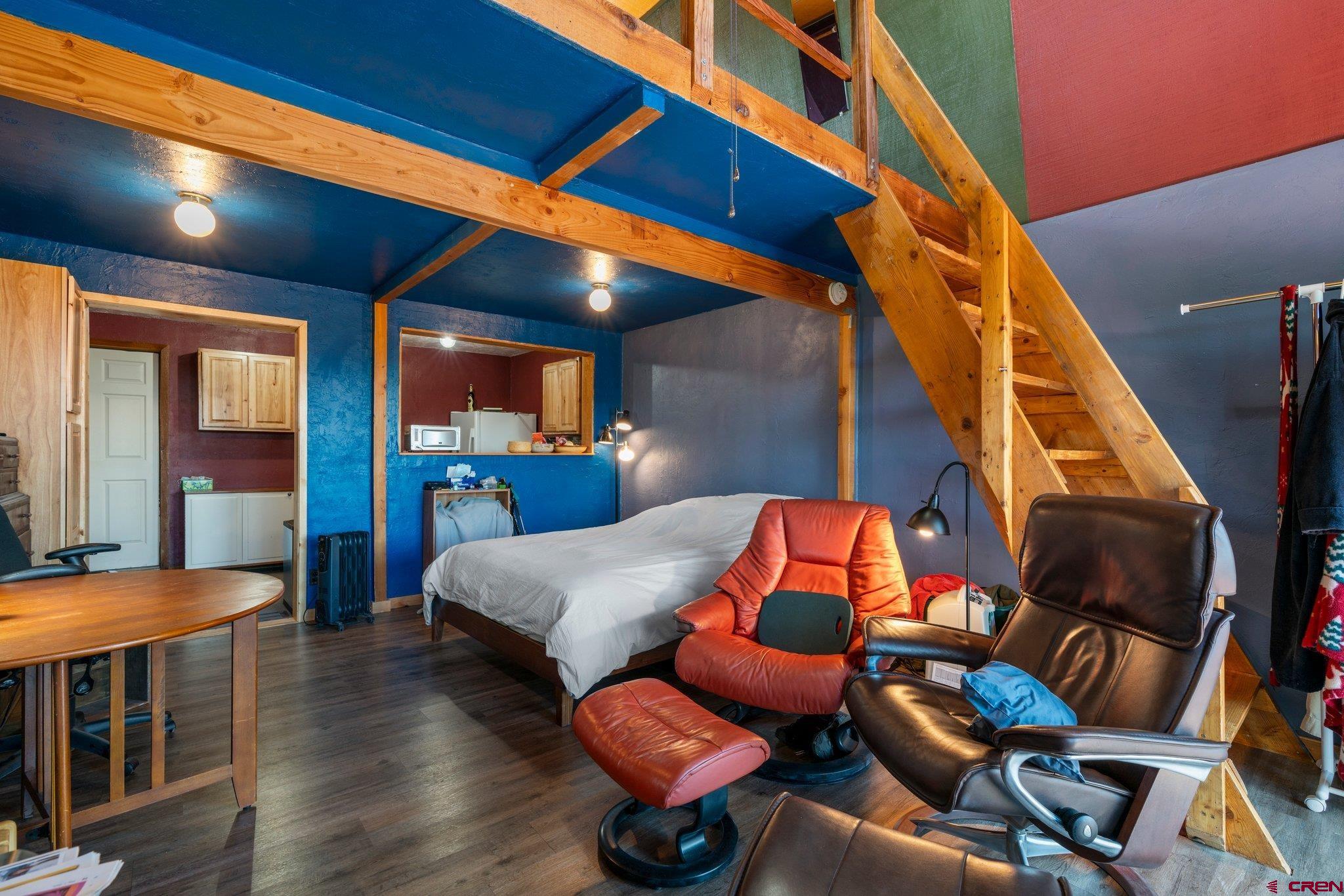 340 Ridge Road Durango, CO 81303 - Photo 24 of 35 a bedroom with furniture and wooden floor