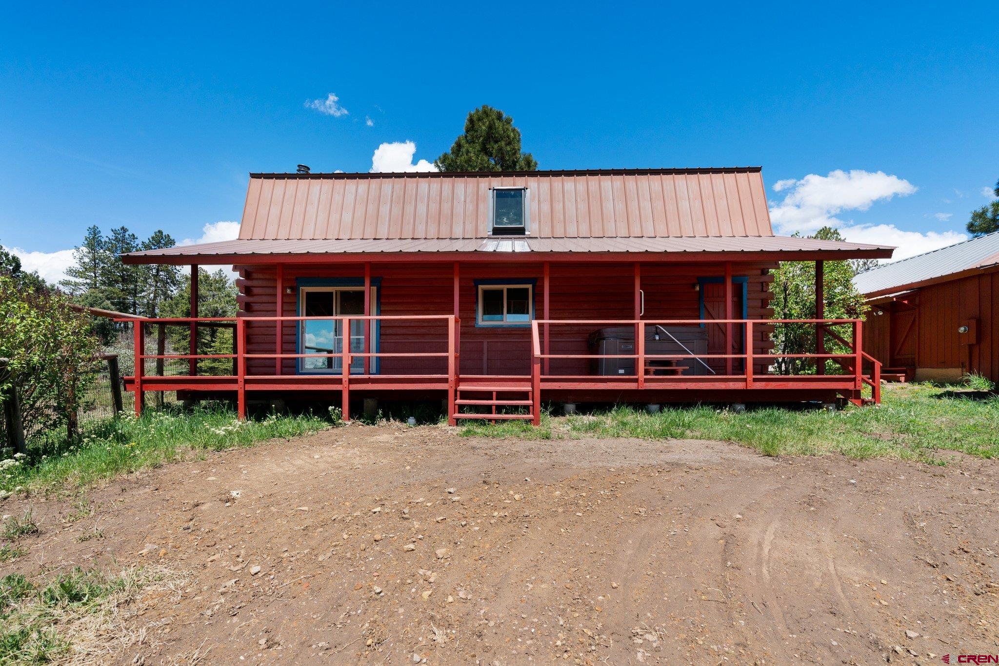 340 Ridge Road Durango, CO 81303 - Photo 29 of 35 a view of a house with a yard and deck
