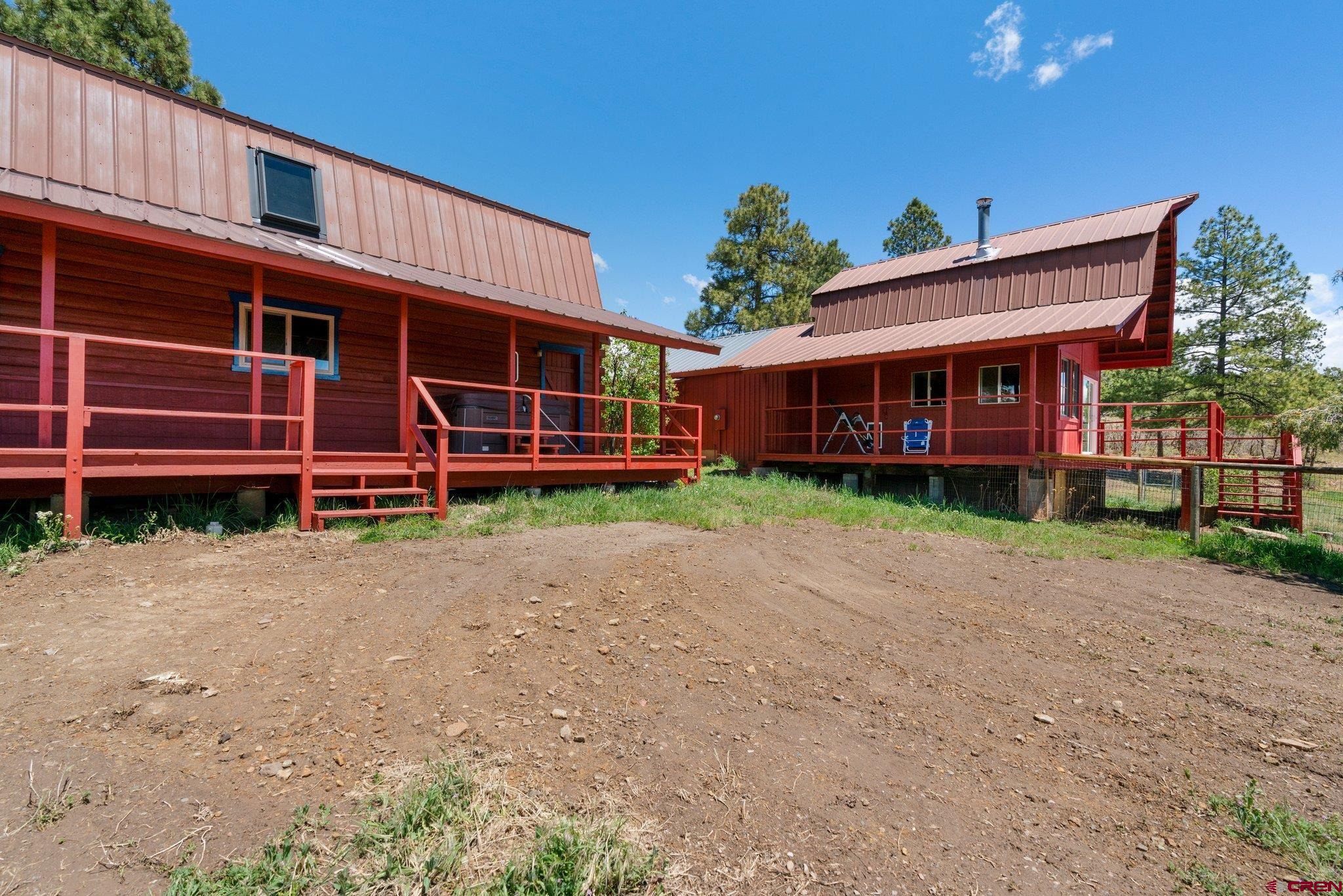 340 Ridge Road Durango, CO 81303 - Photo 30 of 35 front view of a house with a small yard and a large tree